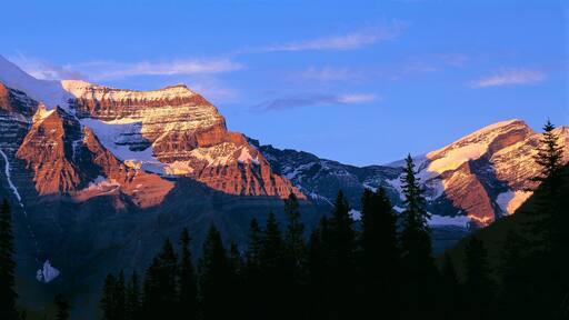 Canada, British Columbia, Mt Robson. The striation on Mount Robson, a World Heritage Site, is accentuated by the sunset light, in British Columbia, Canada.