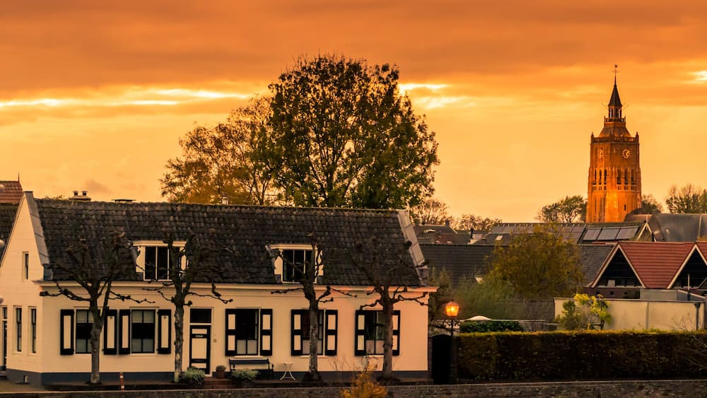 City skyline view of Leerdam the netherlands at sunset, a typical dutch city.