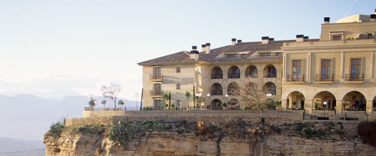 A cliff with a building on top.