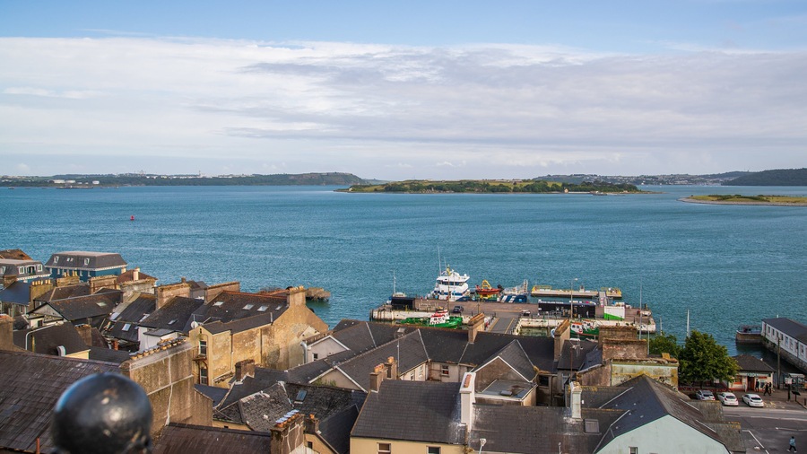 Spike Island showing a bay or harbor and a coastal town