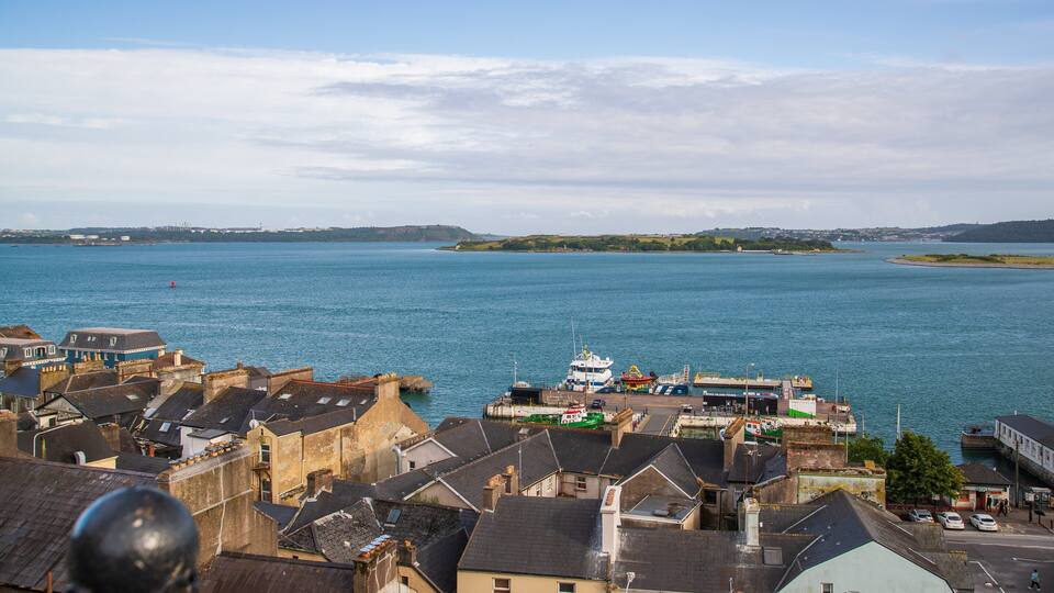 A coastal town with buildings and a ferry dock.