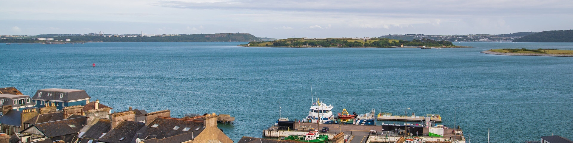 Spike Island showing a bay or harbor and a coastal town