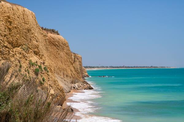 Fuente del Gallo Beach featuring general coastal views and rocky coastline