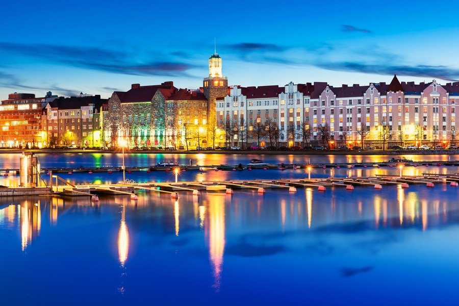 Scenic evening panorama of sea pier illuminated architecture in Hakaniemi district in Helsinki, Finland; Shutterstock ID 228028924