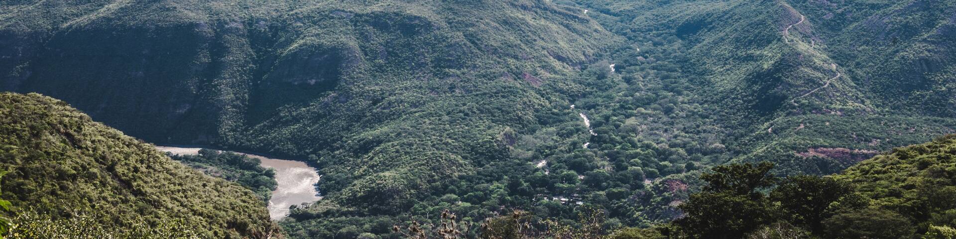River runs through Cañon Chicamocha, or Chicamocha Canyon, in Santander Colombia. The second largest canyon in the world - steep and lush green