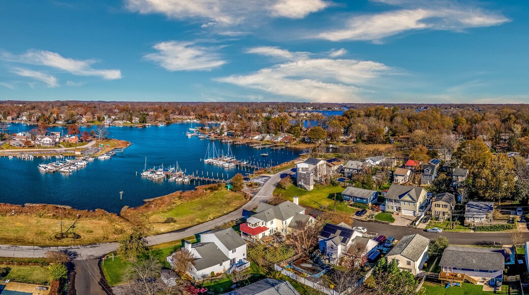 Aerial panorama view of Edgewater Maryland Almshouse Creek South River marina with luxury sail boats turquoise water, popular retirement community near Annapolis