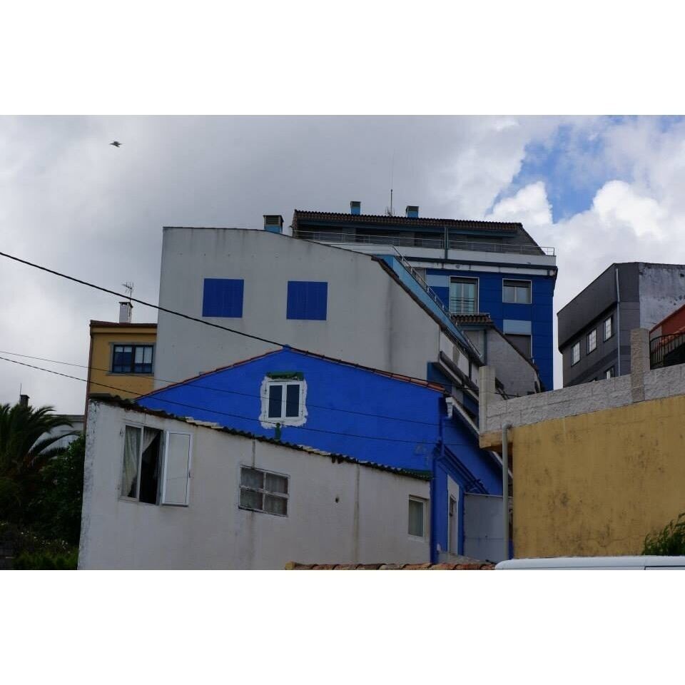 Small harbour with colourful houses and a touch of "real Galicia".