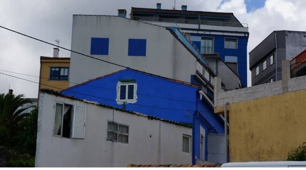 Small harbour with colourful houses and a touch of "real Galicia".