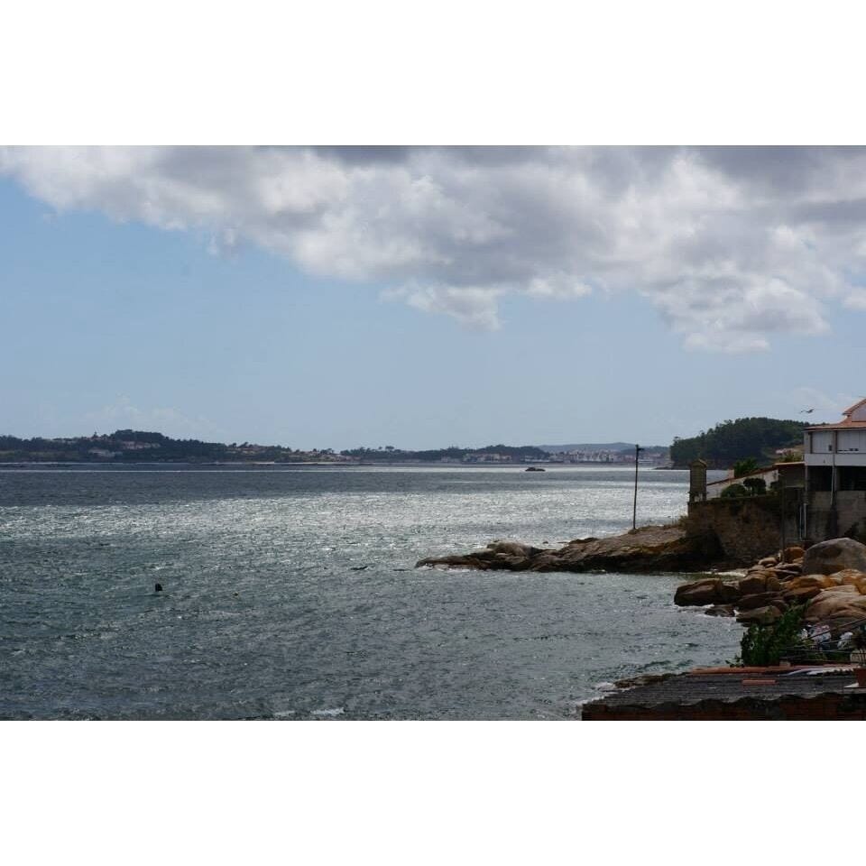 Small harbour with colourful houses and a touch of "real Galicia".