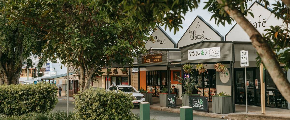 Woodford featuring a small town or village and signage