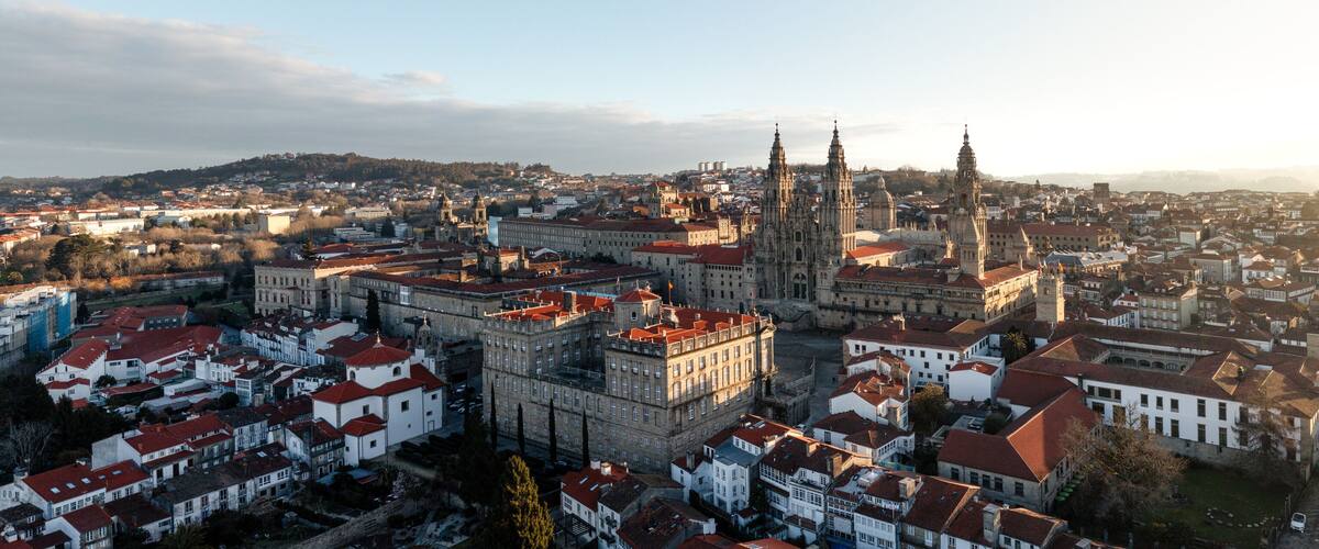 A cityscape with a prominent cathedral and surrounding historic buildings.