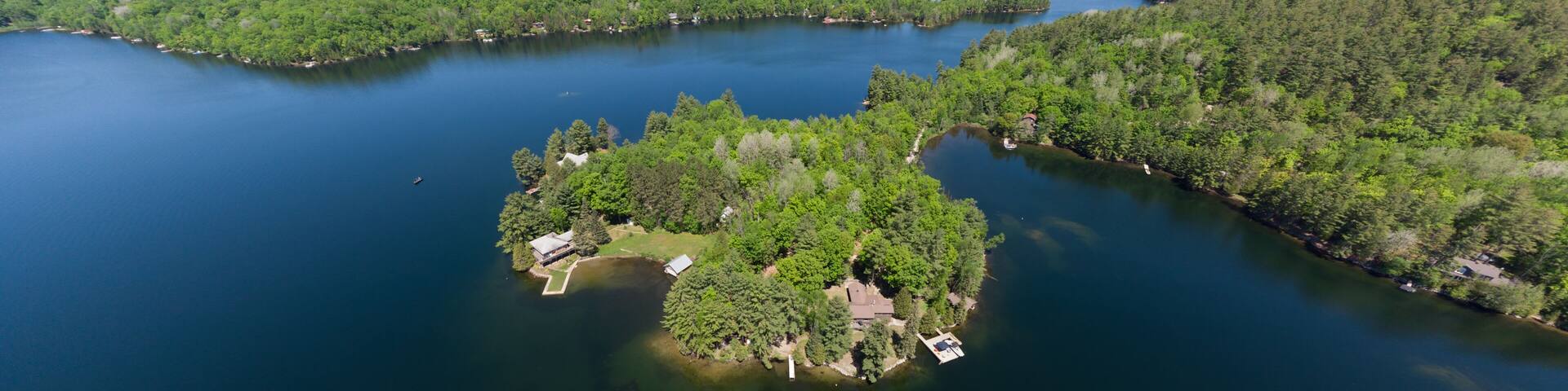 Drone aerial shot over Grand Lake in Val-des-Monts, QC, Canada