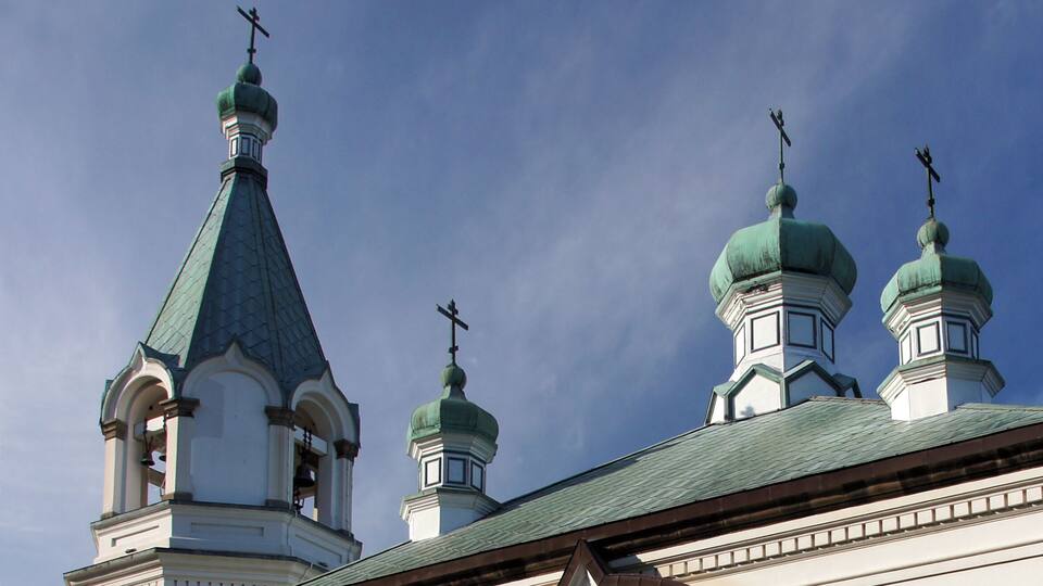 A church with multiple domes and crosses on top.