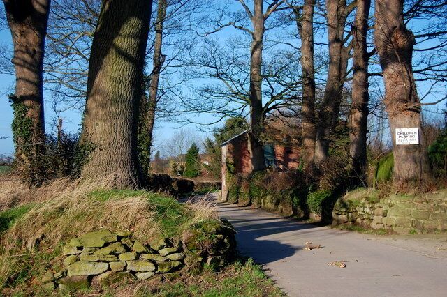 Entrance to Horton Hall Footpath ends at this entrance to Horton Hall. The Hall is out of shot on the right and the road continues past workshops, which can be seen on the right and onwards to farm buildings.
