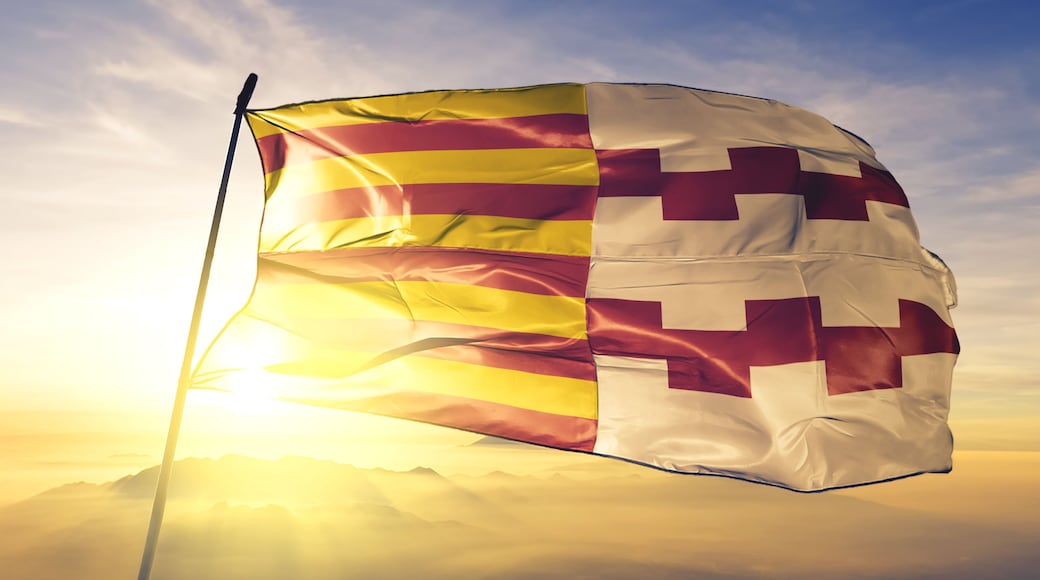 Hamont-Achel of Limburg of Belgium flag waving on the top sunrise mist fog