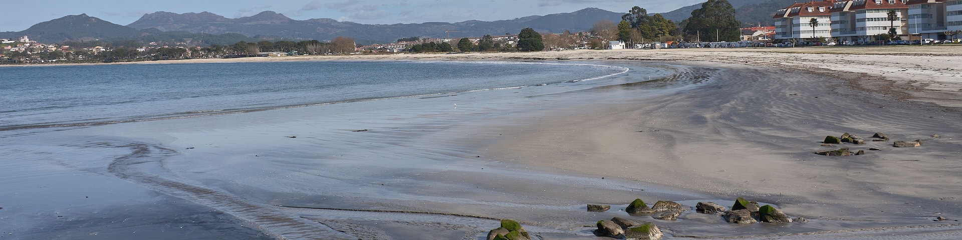 Ladeira Beach in Baiona under a sky of soft clouds reflecting the natural light of March in Galicia