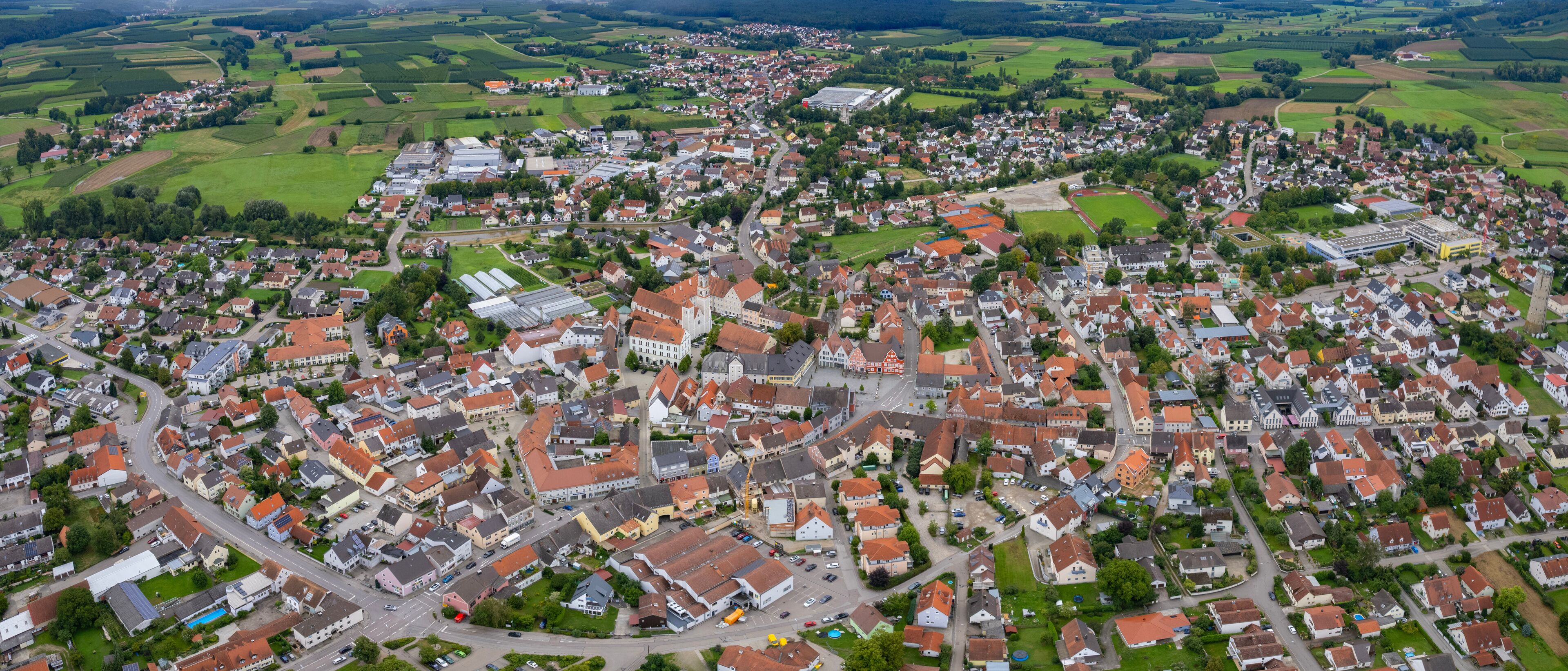 Aerial panoramic view around the old town of the city Geisenfeld, 85290 on a cloudy spring noon in Germany.