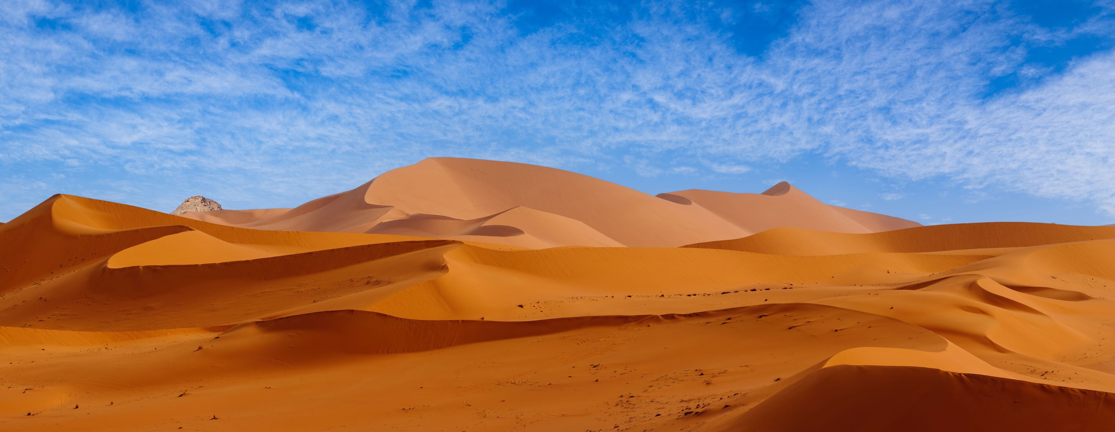 Tadrart Rouge, meaning Red Mountain, a mountain range in southeastern Algeria, part of the Algerian Desert providing massive dunes, rock formations and Martian landscapes