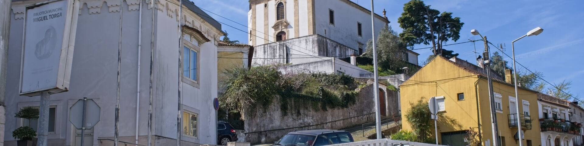 Miranda do Corvo, Portugal - March 25, 2023: Beautiful scenery from the street of Miranda do Corvo. Blue tile panels (azulejos). Sunny spring day. Selective focus