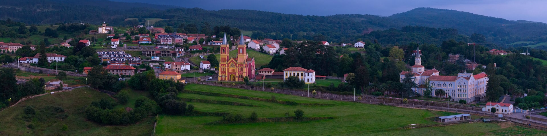 Aerial view from a drone of the neo-Gothic Church of San Pedro Ad Enlace in the town of Cóbreces, in the municipality of Alfoz de Loredo. Cóbreces, Cantabria, Spain, Europe