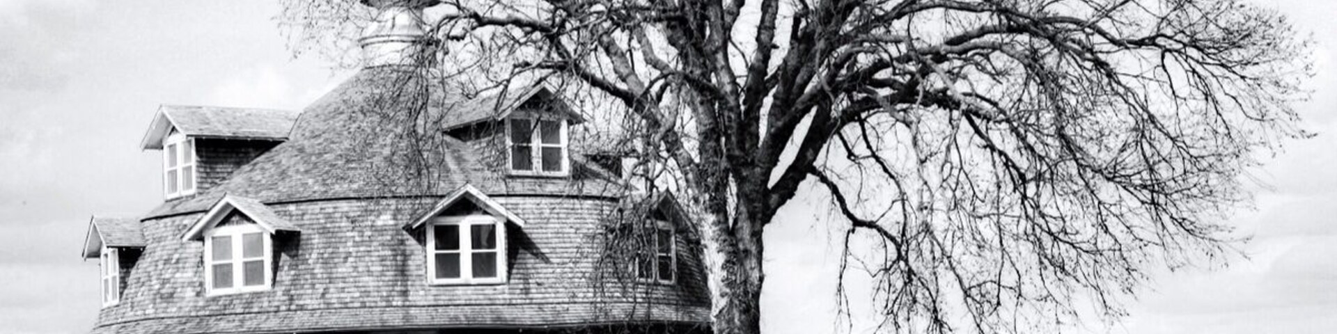 Found this place while driving to find a place to camp. Saw it from the highway. It was built in 1902, is on the historic local registry, is for sale!, is completely round, and has a bunch of garages. That's about all I know about it other then it looks awesome! I drove straight up to it. Parked in driveway, and walked around. It was for sale so it was pretty easy to walk around. Cool place! Never seen anything like it.