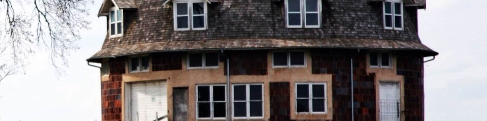 Found this place while driving to find a place to camp. Saw it from the highway. It was built in 1902, is on the historic local registry, is for sale!, is completely round, and has a bunch of garages. That's about all I know about it other then it looks awesome! I drove straight up to it. Parked in driveway, and walked around. It was for sale so it was pretty easy to walk around. Cool place! Never seen anything like it.