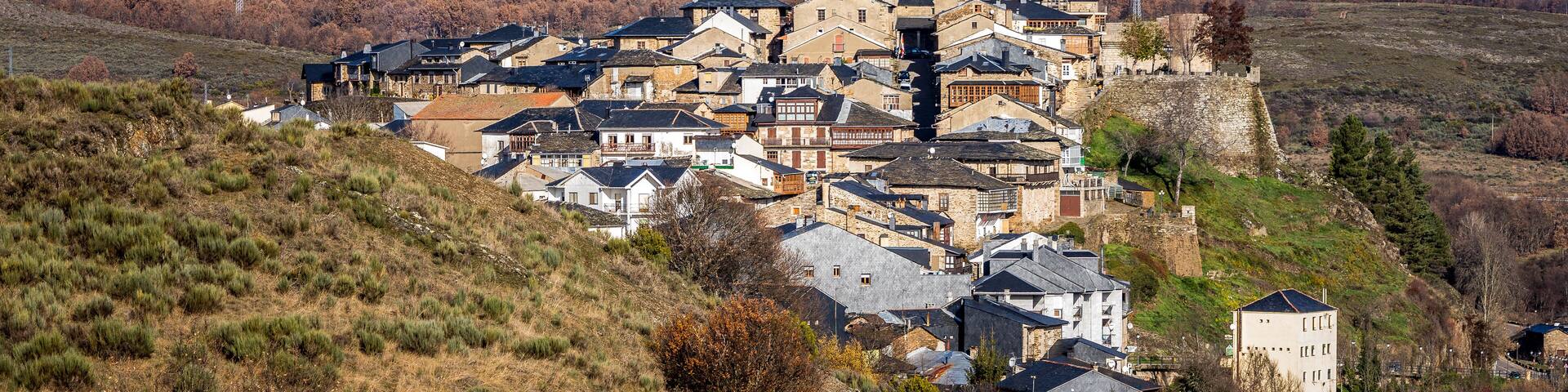 View of the village of Puebla de Sanabria (Zamora) and snow covered mountains.