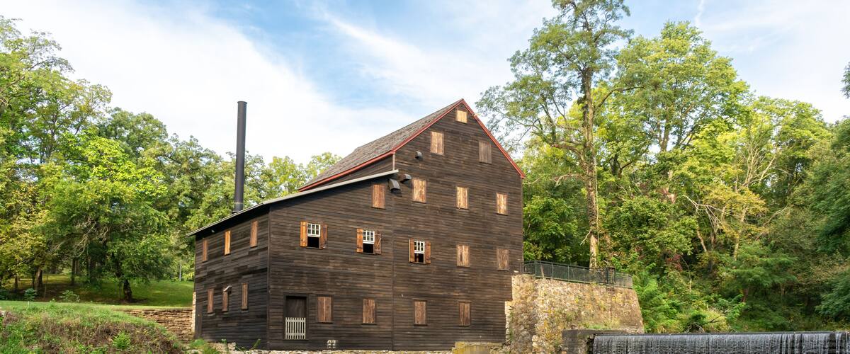 Pine Creek Grist Mill, built in 1848, on a sunny summer morning at Wildcat Den State Park. Muscatine, Iowa, USA.