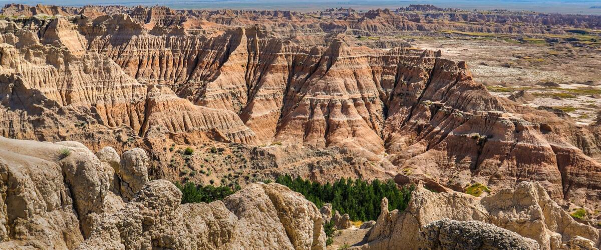 A rugged landscape with prominent rock formations and sparse vegetation.