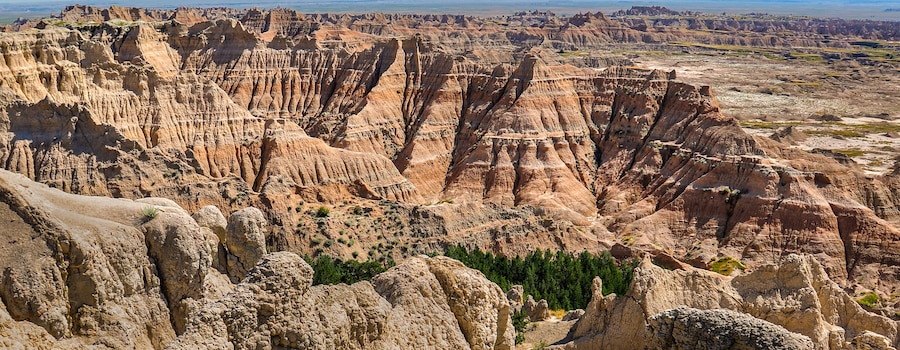 A rugged landscape with prominent rock formations and sparse vegetation.