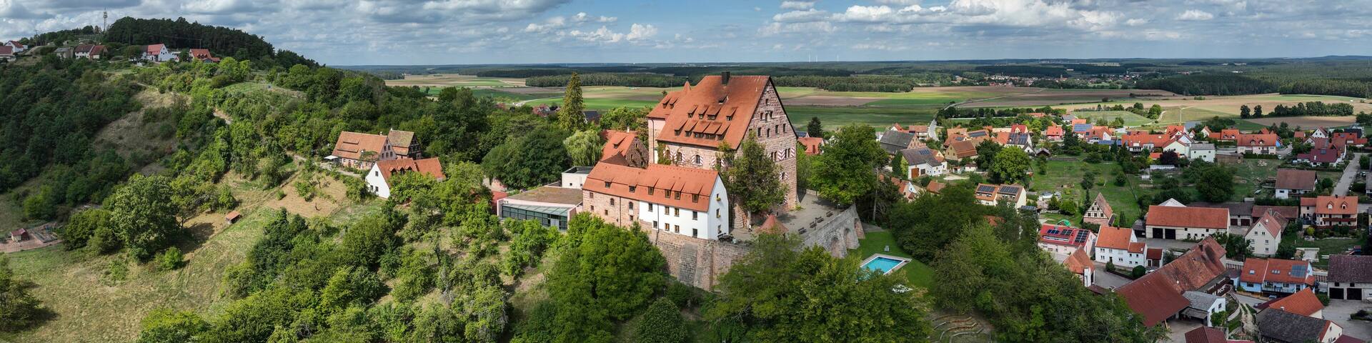 Germany, Bavaria, Spalt, Aerial panorama of clouds over Wernfels Castle