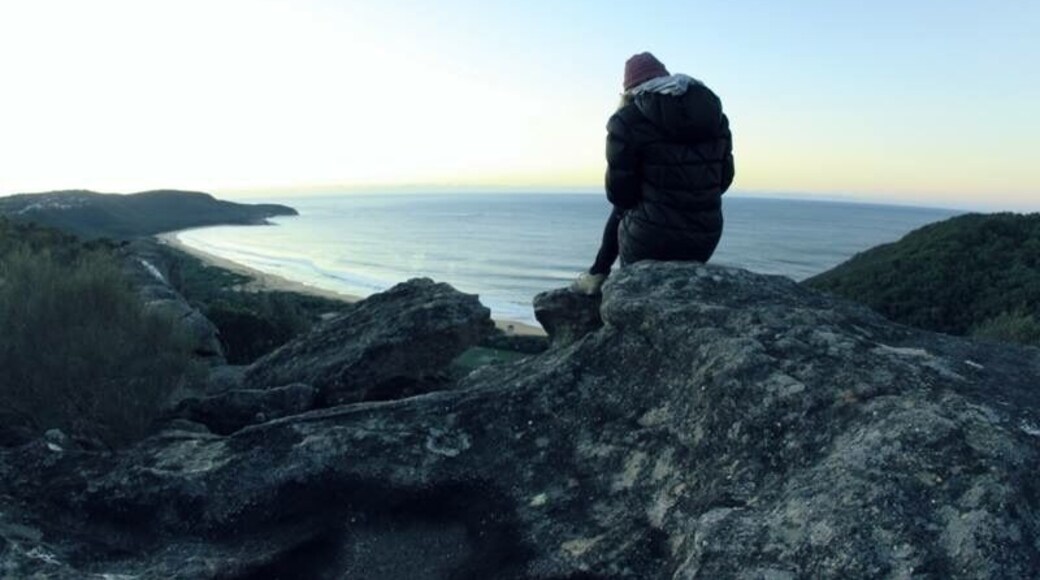 From The Scenic Road (towards Hardys Bay Wharf) take Nukara Ave and follow the dirt road up the cliff for this incredible viewing point of Killcare Beach.
