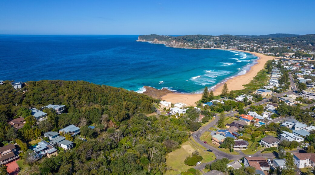 Blue ocean with large waves crashing on to North Avoca Shoreline in New South Wales Australia