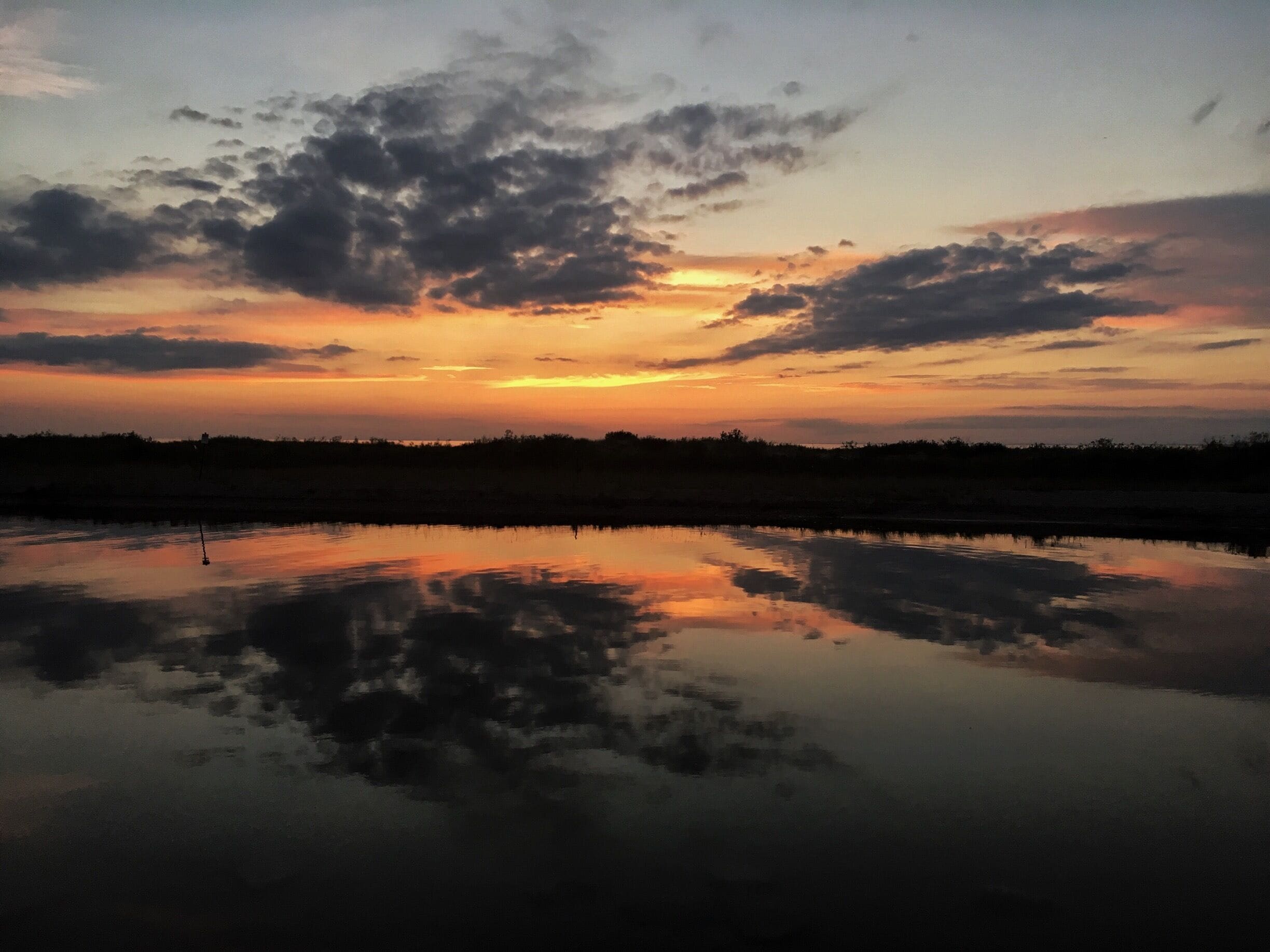 Platte River Point is a great place to catch sunset .... river meets the lake here.