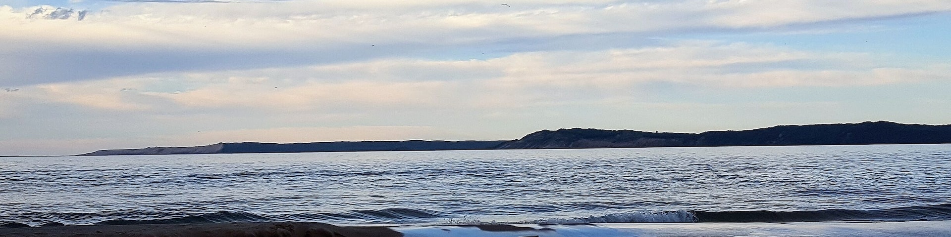 Dusk looking over the Platte River and lake Michigan to the Sleeping Bear Sand Dunes on the horizon.
