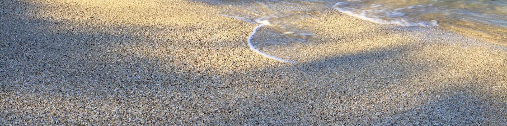 Sand and shells on Playa Conchal and the azure waters of the Pacific Ocean in Guanacaste, Costa RIca; Shutterstock ID 120968659; Purchase Order: -