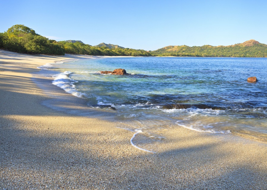 Sand and shells on Playa Conchal and the azure waters of the Pacific Ocean in Guanacaste, Costa RIca; Shutterstock ID 120968659; Purchase Order: -