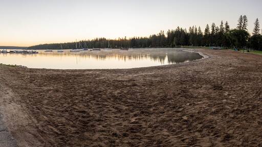Panoramic view of a pier and beach at Clear Lake in Riding Mountain National Park