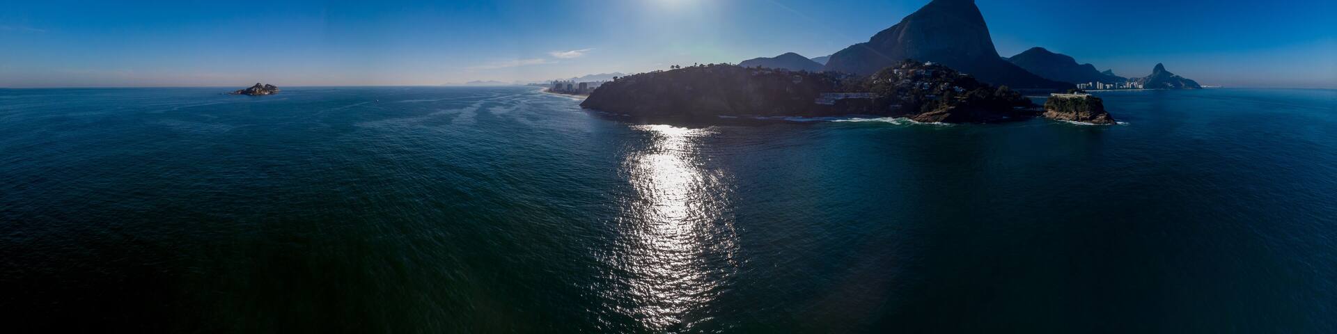 Aerial seascape panorama of the Joatinga beach with the Gavea, Vidigal and Corcovado mountain in the background