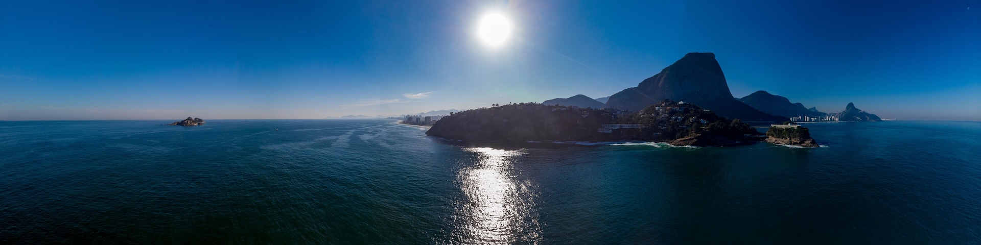 Aerial seascape panorama of the Joatinga beach with the Gavea, Vidigal and Corcovado mountain in the background