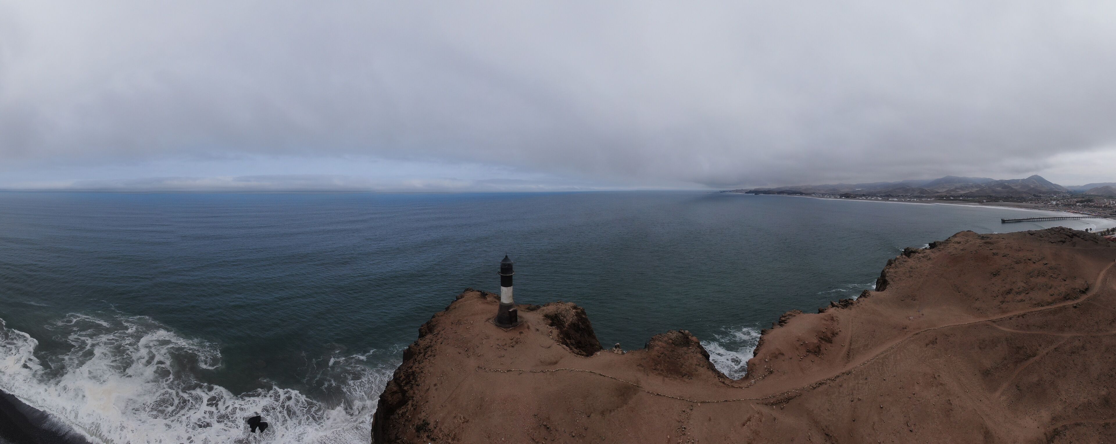 lone lighthouse in the coast of peru