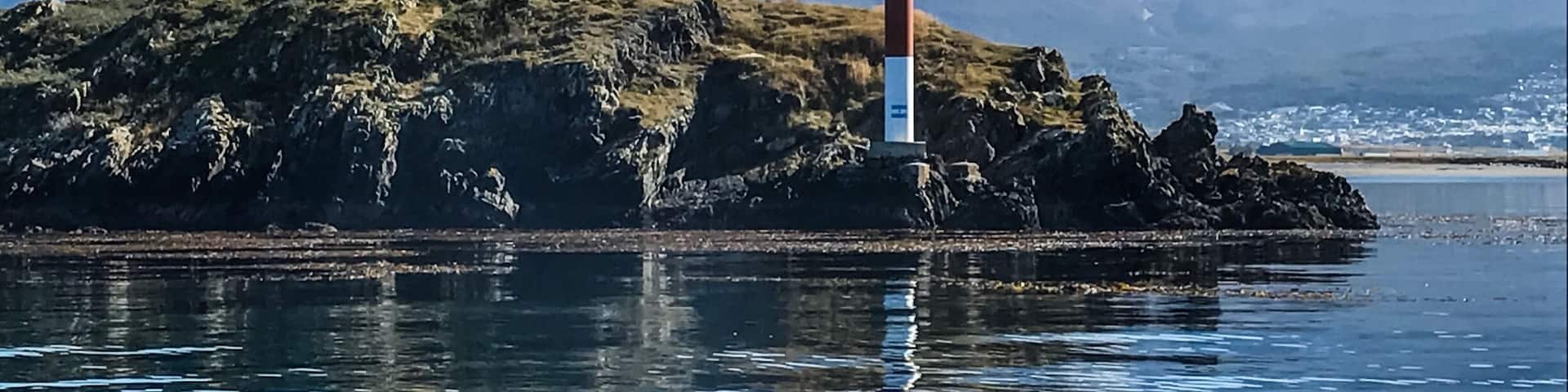 The oppositely colored lighthouse earlier used by ships to cross Beagle Channel. #Ushuaia #tierradelfuegoarchipelago