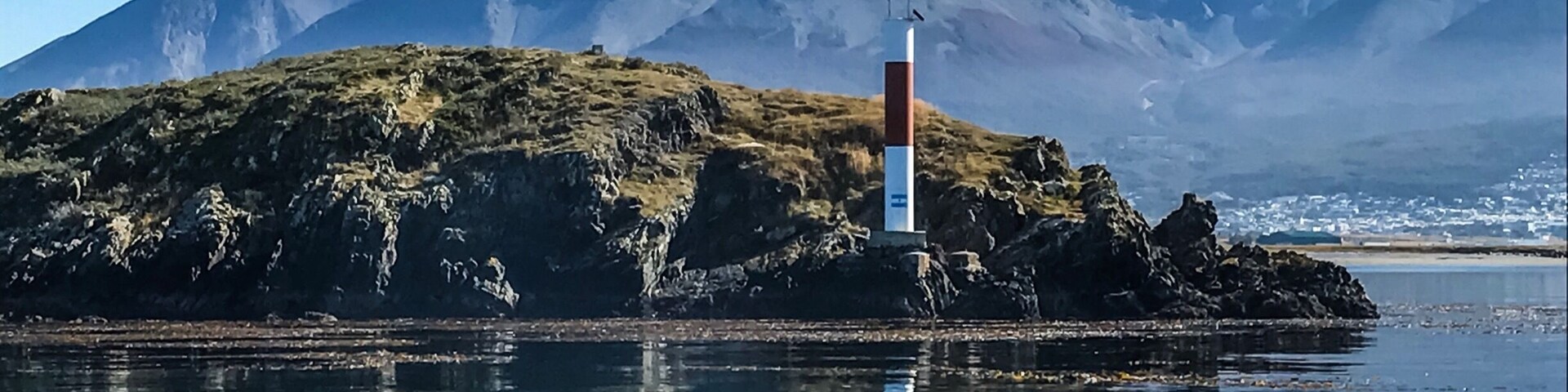 The oppositely colored lighthouse earlier used by ships to cross Beagle Channel. #Ushuaia #tierradelfuegoarchipelago