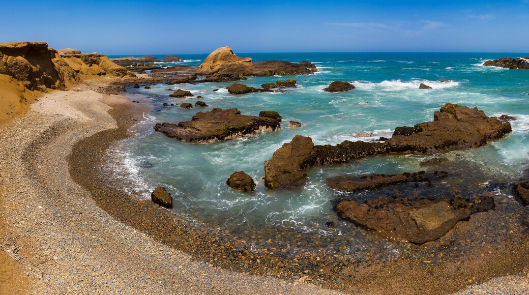 Aerial view of a rocky beach and cliff in Huarmey in Summer, Ancash, Peru
