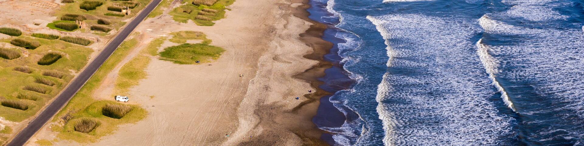 Trujillo, Peru: Aerial view of the coast and the plantation of reeds that are used for the manufacture of Caballitos de totora, small traditional boats from the north of Peru
