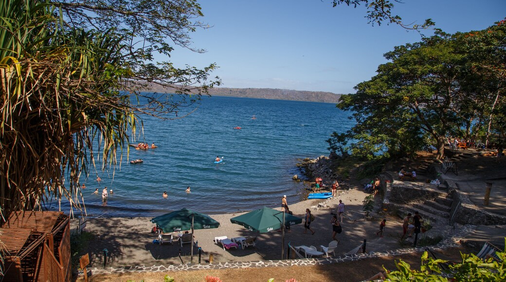 Masaya, Nicaragua – March 12, 2016: Apoyo Lagoon view with people on recreation in sunny day on summer.