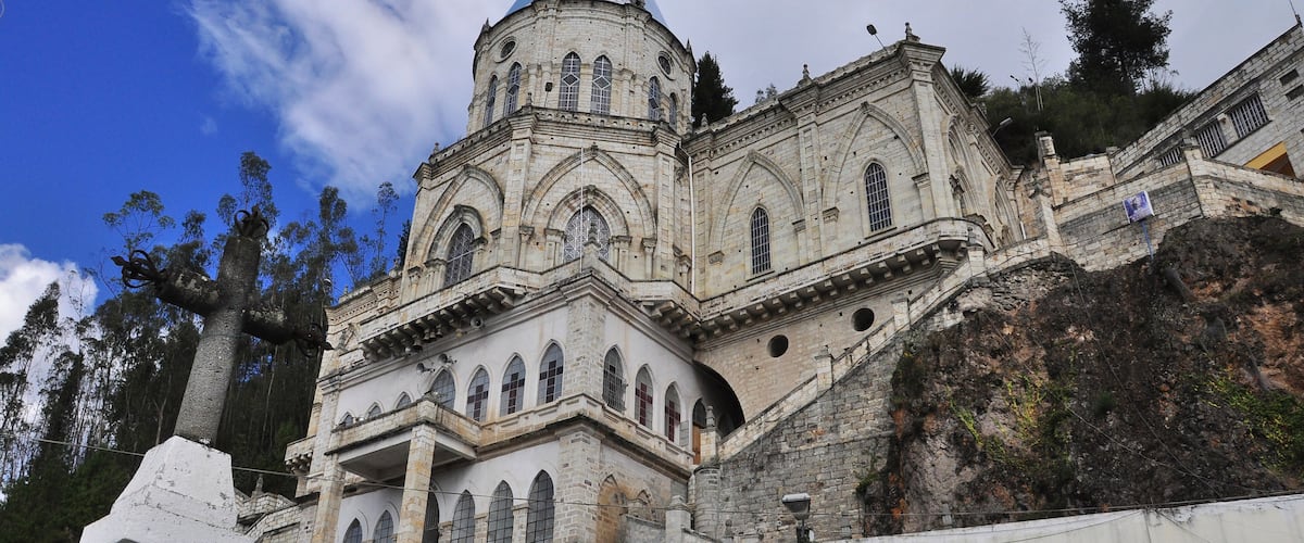 A historic church with a blue dome and arched windows.