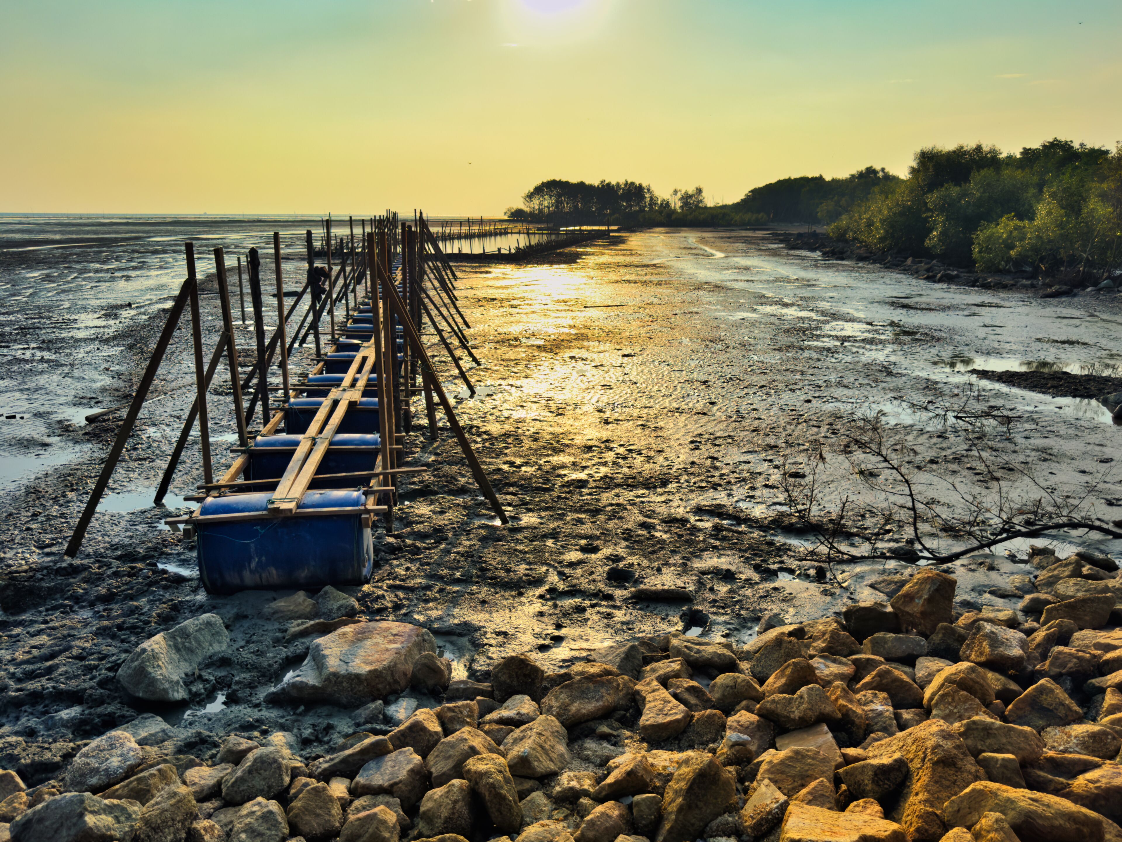 Sunset over small fish pond in Bagan Nakhoda Omar, Sekinchan, Malaysia