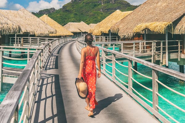 Luxury travel vacation destination panoramic banner. Romantic honeymoon getaway in overwater bungalows villas of Tahiti resort, Bora Bora, French Polynesia. Landscape copy space panorama.