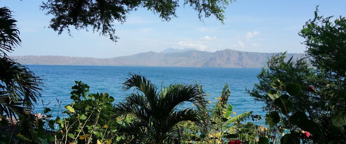 Laguna de Apoyo, a giant carter lake that formed after a volcano imploded on itself. You can see smoking Mombacho Volcano in the background.